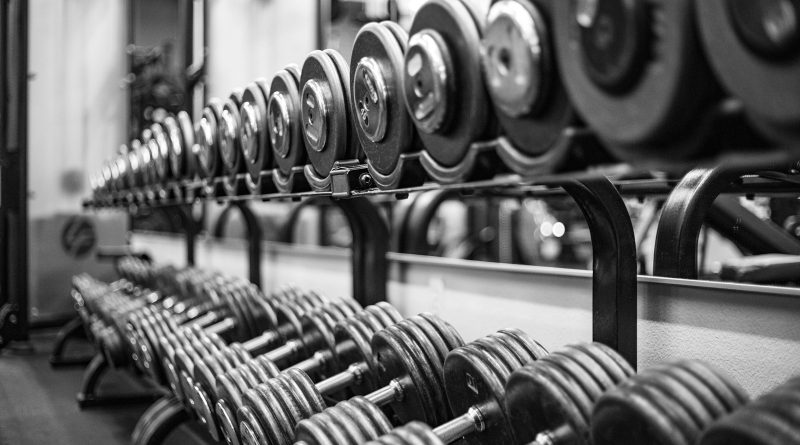 gray scale photo of dumbbells